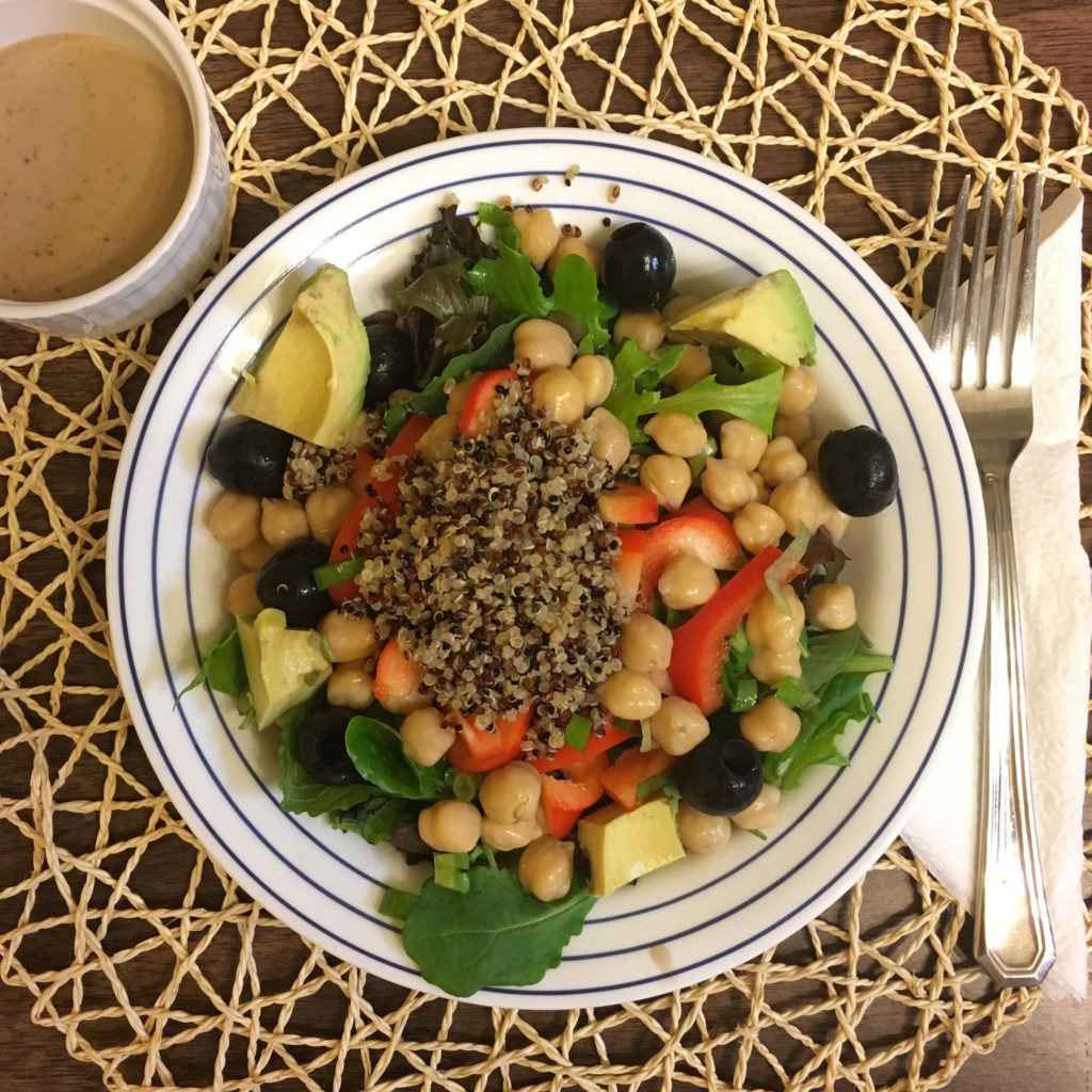 Chickpea salad with spring salad and black olives